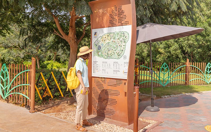 Man looking at Dubai Safari Park Map